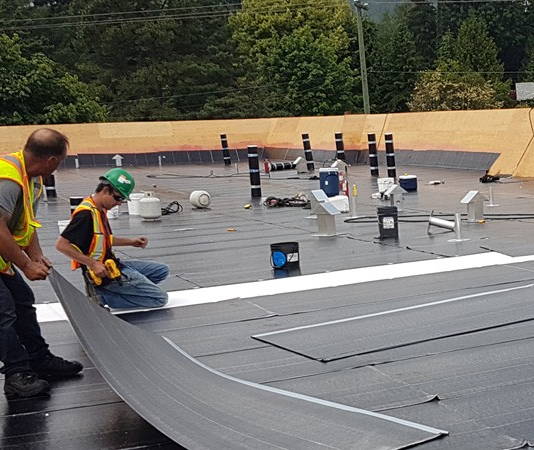 The Complete Guide to Commercial Flat Roof Installation: Best Practices and Considerations